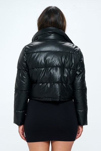 Collab Boutique black faux leather cropped puffy bomber jacket with polyester fill. Features a high collar and quilted design.