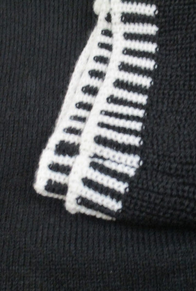 Collab Boutique black knit sweater top with white edge detail on two-layer flare sleeves and neckline. Cotton blend.