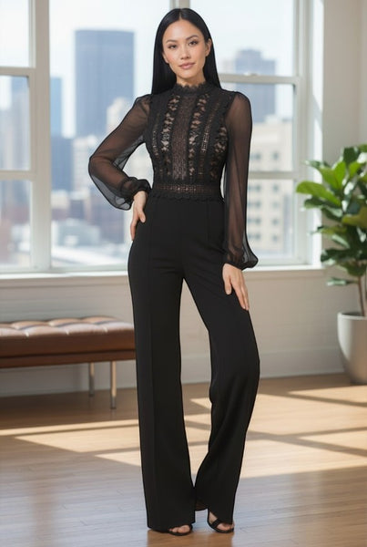 Collab Boutique black lace bodice jumpsuit with sheer balloon sleeves and wide legs. Model wears a size S.