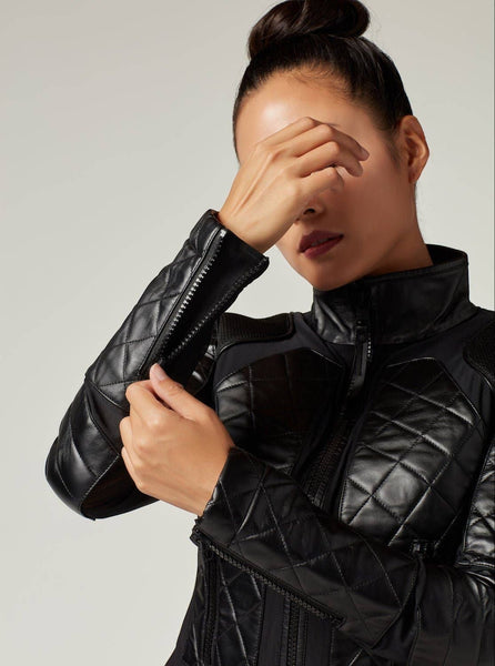 Collab Boutique black diamond quilted leather motorcycle jacket with zipper front and sleeve cuff zippers.