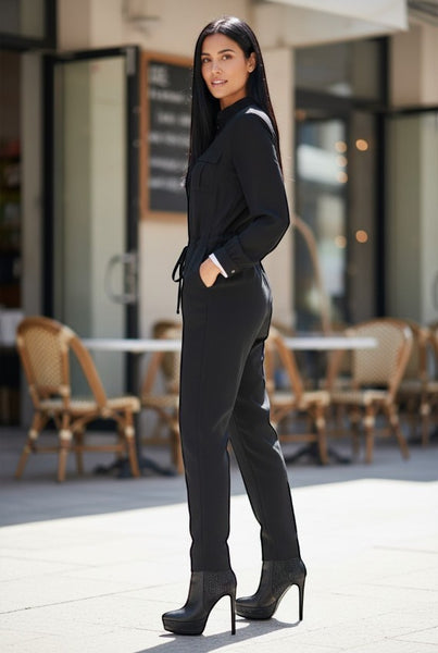 Collab Boutique black polyester-spandex long sleeve jumpsuit with drawstring waist and tapered ankle.
