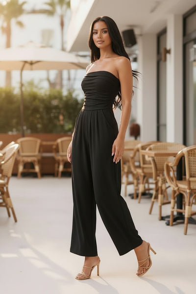 Collab Boutique black strapless shirred tube top palazzo romper with pockets, made of polyester and spandex.