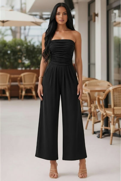 Collab Boutique black strapless shirred tube top palazzo romper with pockets, made of polyester and spandex.