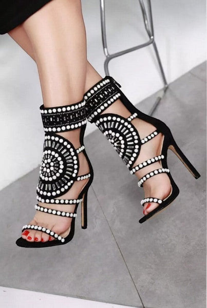 Collab Boutique black faux suede heels with pearl and rhinestone embellishments, back zipper, and open toe.