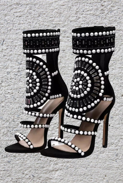 Collab Boutique black faux suede gladiator heels with pearl and rhinestone embellishments and back zipper.