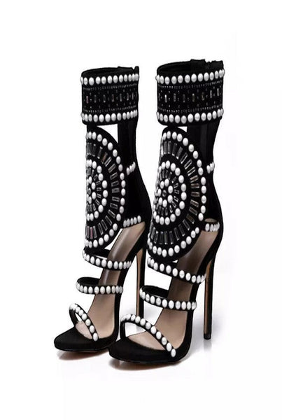 Collab Boutique black faux suede gladiator heels with pearl and rhinestone embellishments and back zipper.