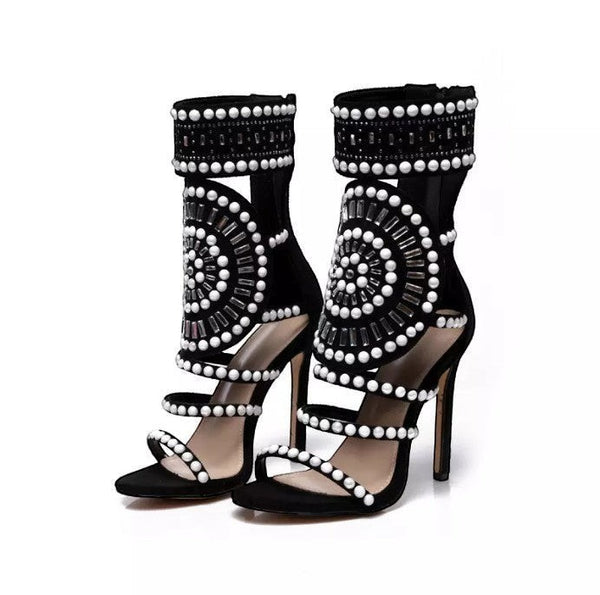 Collab Boutique black faux suede heeled sandals with pearl and rhinestone embellishments. Open toe, strappy design.
