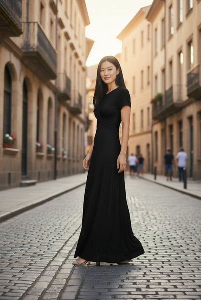 Collab Boutique black rayon spandex crew neck maxi dress with short sleeves and twisted detail on a model.