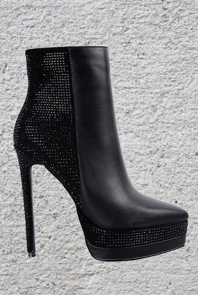Collab Boutique black faux leather ankle boots with diamante embellishments on the heel, platform, and back. Features a pointed toe and side zipper.