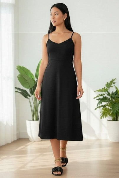 Collab Boutique black ruffle slip-on flat sandals.