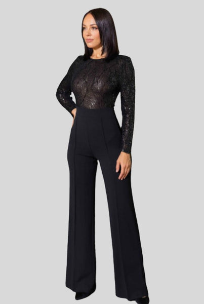 Collab Boutique black sequin jumpsuit with long sleeves and flared legs. Model is 5'8, wearing size S.