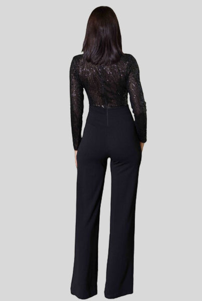 Collab Boutique black sequin jumpsuit with long sleeves and flared legs. Back zipper closure. Polyester and spandex blend.