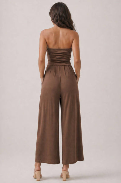 Collab Boutique brown strapless shirred tube top palazzo romper with pockets, made of polyester and spandex.