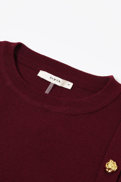 Collab Boutique burgundy knit crew neck pullover top with gold buttons and white pleated detail. Cotton and viscose blend.