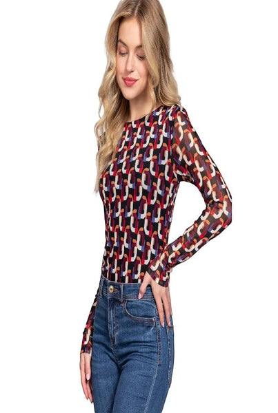 Collab Boutique long sleeve crew neck bodysuit with a colorful geometric pattern in black, red, white, and blue mesh fabric.