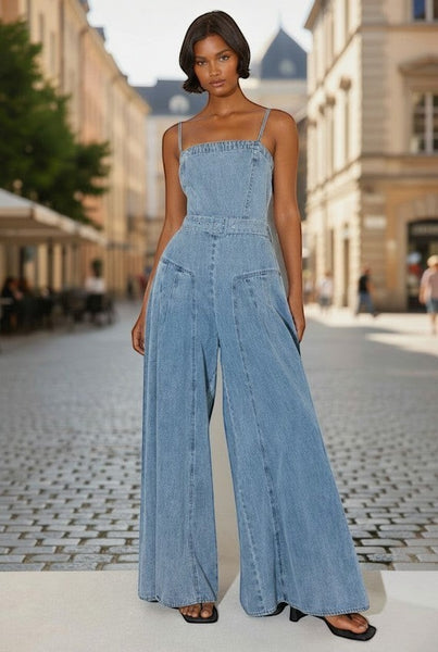 Collab Boutique light wash denim wide leg jumpsuit with square neckline, spaghetti straps, and matching belt.