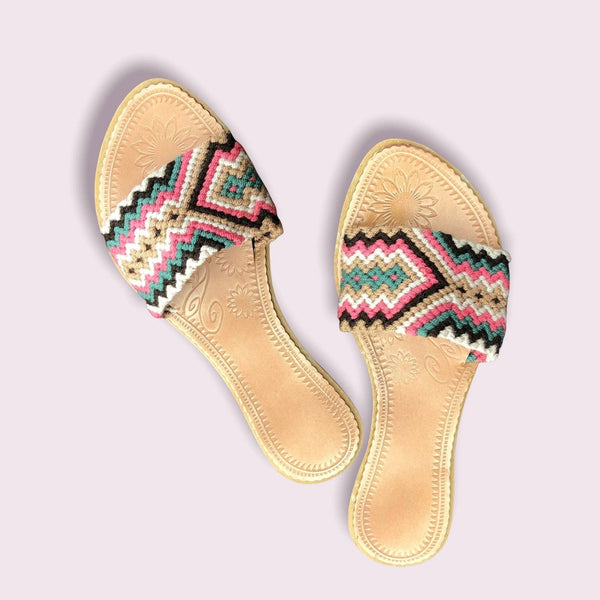 Collab Boutique colorful handwoven slide sandals with geometric patterns in coral, tan, dark brown, green, and ivory.
