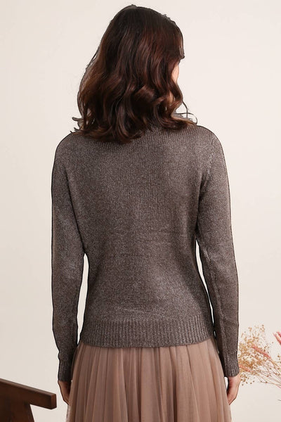 Collab Boutique metallic knit V-neck cardigan with ribbed edges and silver buttons. Polyester, Polyamide.