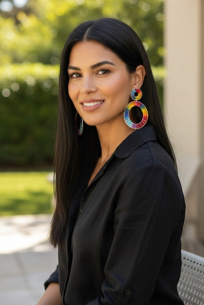 Collab Boutique colorful raffia hoop earrings with rainbow thread detail and zinc alloy base.