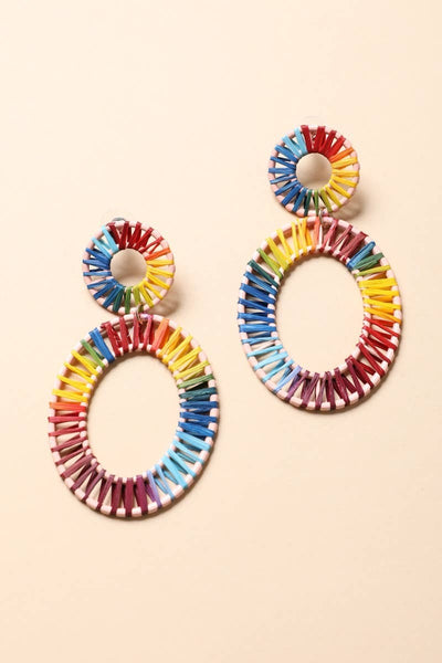 Collab Boutique colorful raffia hoop earrings with rainbow thread detail and zinc alloy backing.