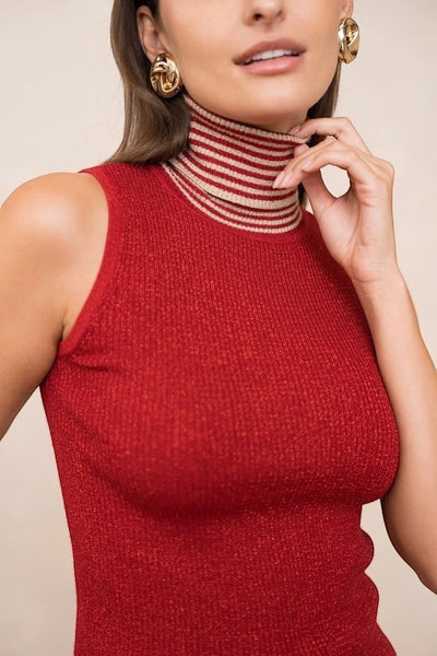 Collab Boutique red sleeveless knit turtleneck sweater with lurex glitter and striped collar.
