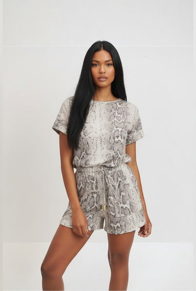 Collab Boutique neutral snake print lounge set with cuffed short sleeves and drawstring shorts. Model wears a size S.
