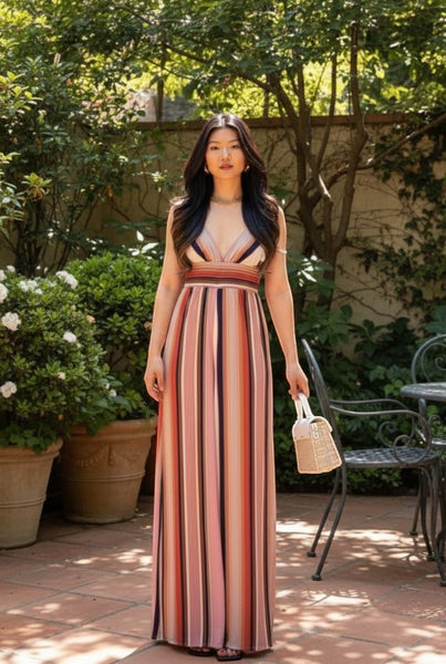 Collab Boutique multi-color striped wide-leg jumpsuit with adjustable straps and a V-neck. Model wears a size S.