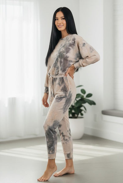 Collab Boutique neutral tie-dye lounge set with crew neck sweatshirt and joggers. Model is wearing a size S.