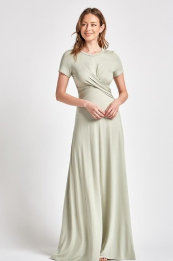 Solid rayon spandex t shirt maxi dress featuring round neck, short sleeve and twisted top detail