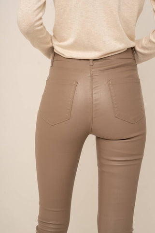 Taupe faux leather pants. Coated jean style pants. 